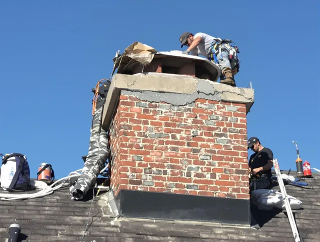 Delray Beach Chimney Sweep installing a custom chimney crown in Delray Beach, FL